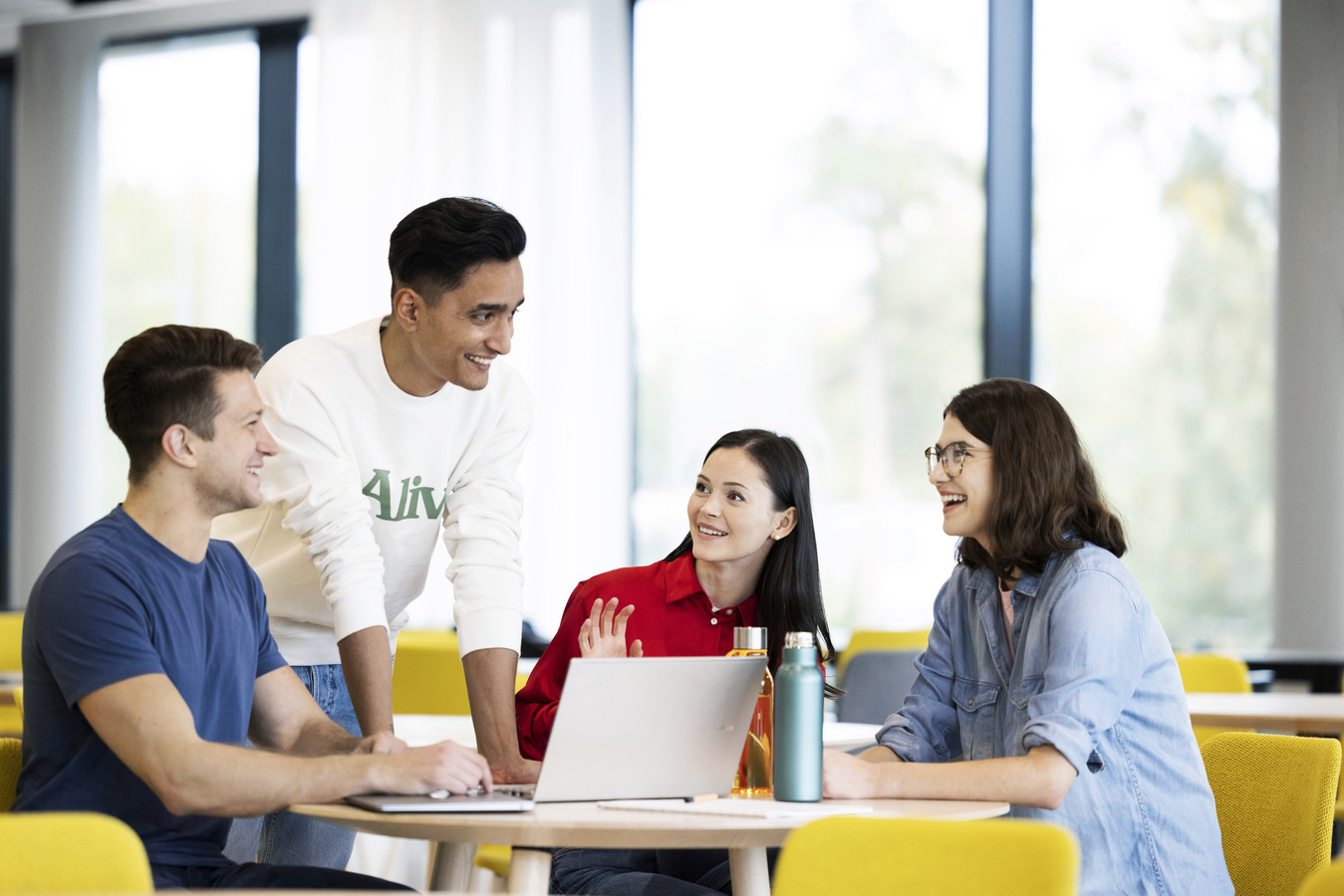 Students studying in front of a computer