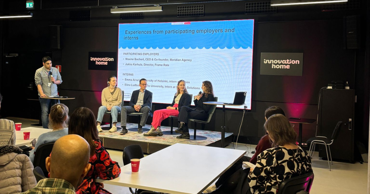 Participants discussing at the closing ceremony of the International Voucher pilot.