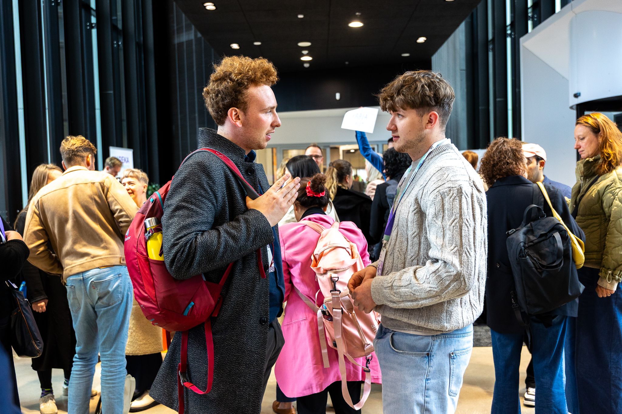 Two students standing next to each other