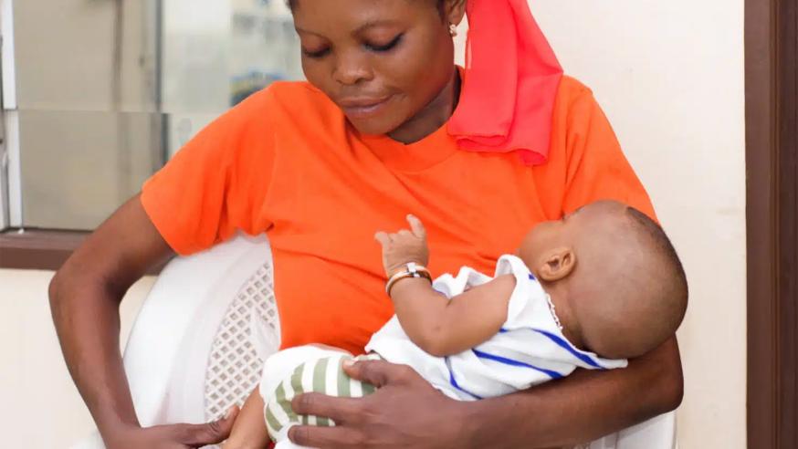 Woman holding a child.