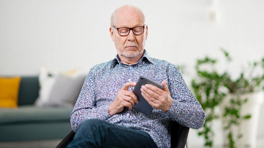 Old man having a phone in his hand