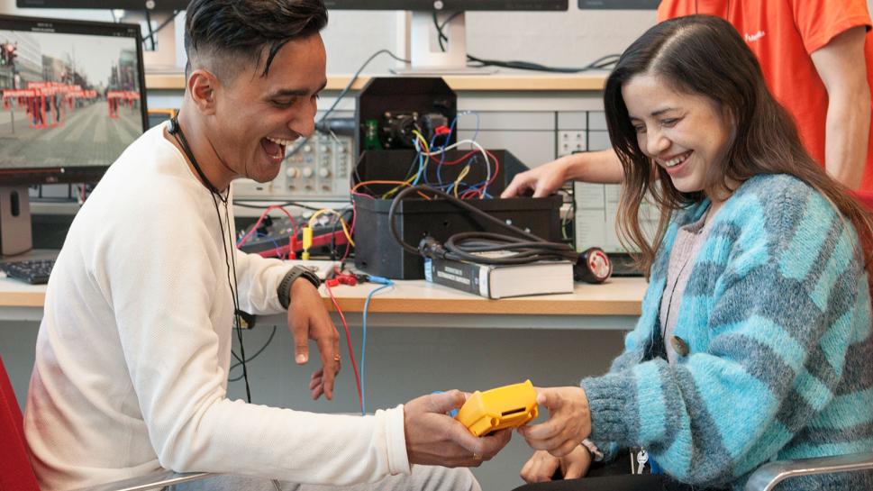 Two students working in IoT lab.