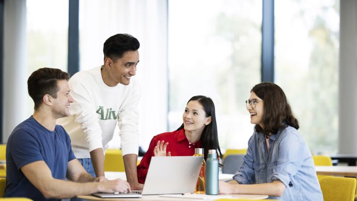 Students studying in front of a computer