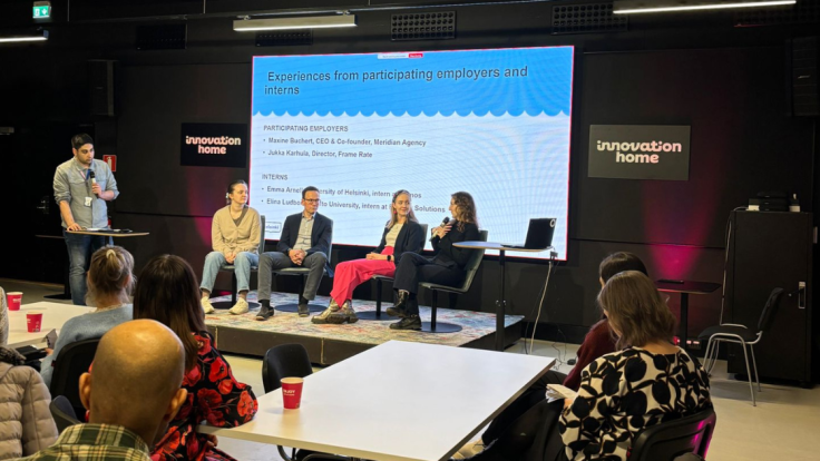 Participants discussing at the closing ceremony of the International Voucher pilot.