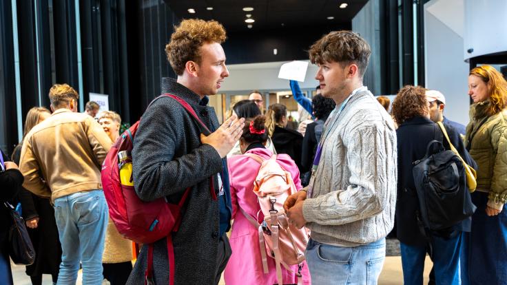 Two students talking to each other