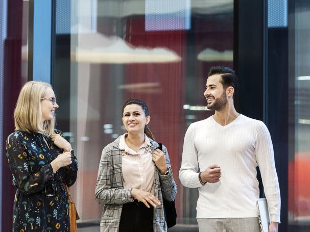 Two customers meeting a career mentor at Metropolia campus.