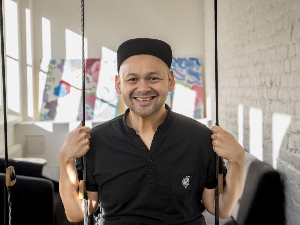 a student sitting on a swing chair