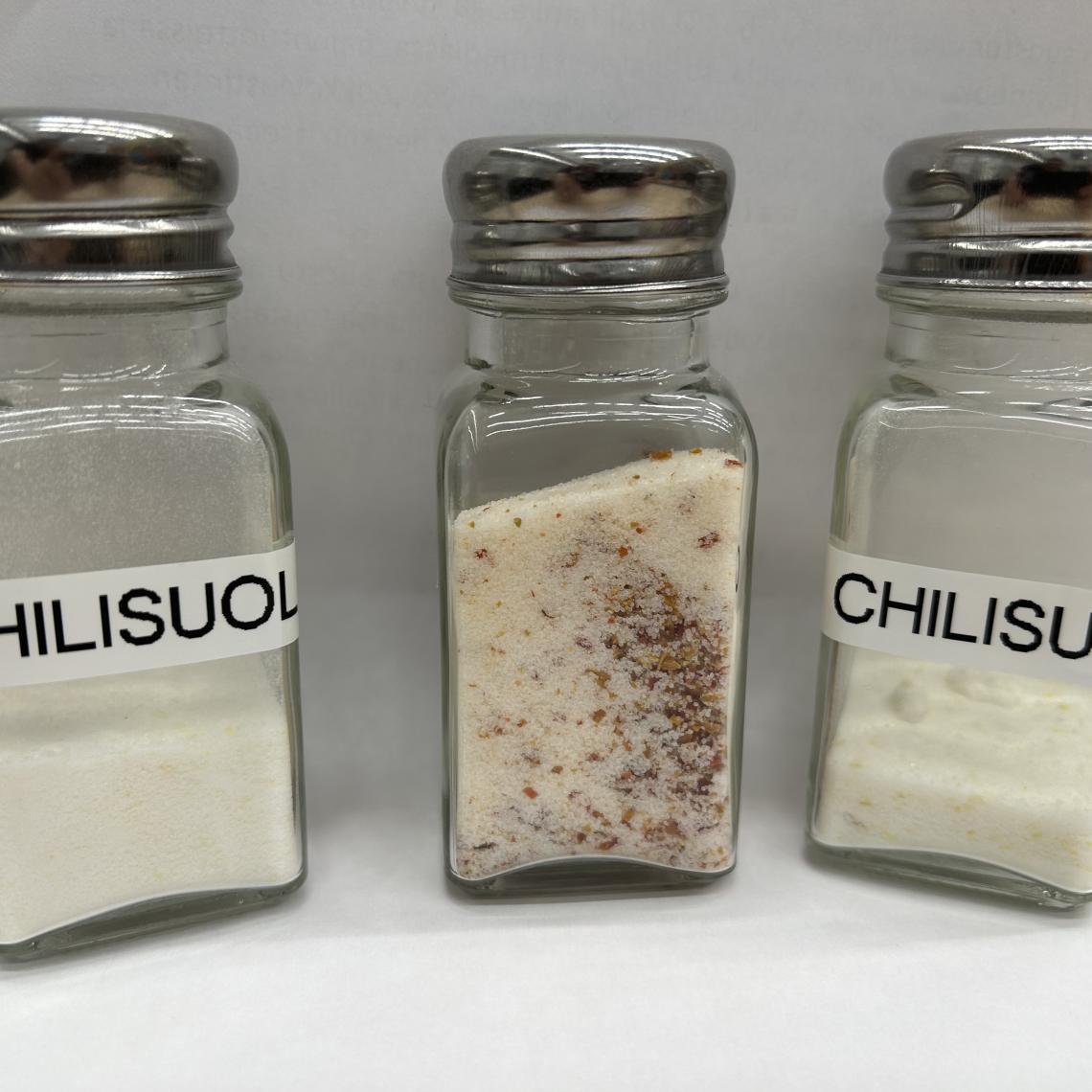 Three shakers of chilisalt, with different recepies