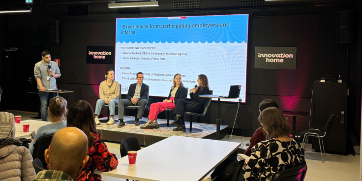 Participants discussing at the closing ceremony of the International Voucher pilot.