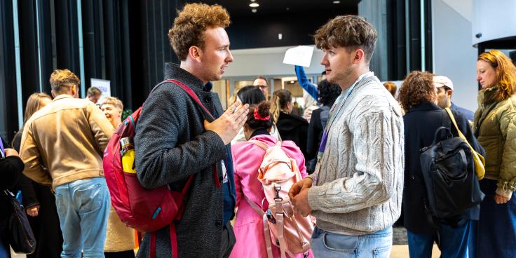Two students talking to each other