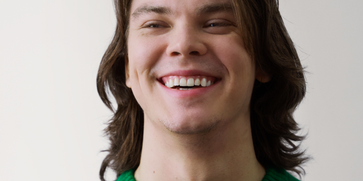 Young man smiling.