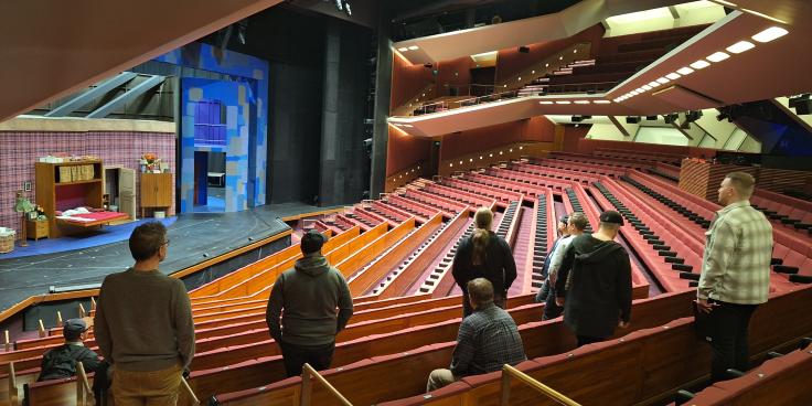 Students checking theatre scene