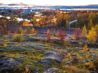 View from rocks to railway, colorful leaves on trees.